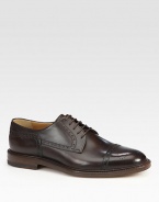 Leather lace-up derby with cap-toe and brogue detailing.Leather soleMade in Italy