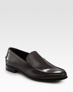 A finely crafted, moccasin-style slip-on is distinguished by debossed logo detail and stacked leather heel. Leather liningPadded insoleLeather soleMade in Italy