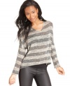 Casual with a wild side, Ultra Flirt's knit top fuses sporty stripes and a relaxed fit with a back of cutouts and lace!