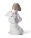 An angel holds in its lap a dove, the symbol of peace. Crafted by Lladró, Spain's most esteemed artisans of porcelain figurines.