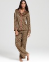 Ready, set, sleep in LAYLA's leopard-print pajamas with contrast trim and a classic notch-collar top.