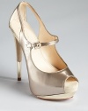 A gleaming gold-tone platform and heel tip make for a showstopping entrance and an unforgettable exit. From Boutique 9.