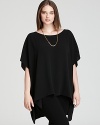 Bohemian ease meets city edge as luxe silk enlivens an oversized Eileen Fisher Plus tunic for real modern edge.