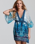 Enliven your poolside portfolio with Gottex's paisley printed tunic. When it's time to take cover, this bohemian-inspired mini gets splashy with aviator frames and a straw hat.