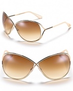 Tom Ford's oversized sunglasses are full of movie-star chic. With cross-front metal frames and exposed lenses. Adjustable nose piece helps to secure fit.