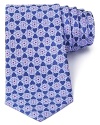 A nature-inspired pattern of snowflake-like flowers adorns this handsome tie from Valentino, a refined design in pure Italian silk.