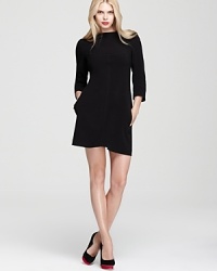 With a streamlined silhouette and understated palette, this quilted Rachel Roy dress exercises a restrained minimalism.