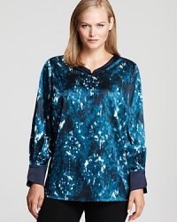 Splashed with a blurred abstract print, this Tahari Woman Plus blouse takes your 9-to-5 look to dramatic style depths.