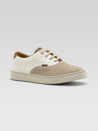 A handsome cross between an oxford and a sneaker, your young man can wear this as both with its combination of sporty cotton and rich suede.Cotton and suede upperFour-grommet lace-up frontStriped webbed tab accentSmooth leather trimRubber soleMade in Italy