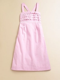 Crafted in preppy seersucker, this classic A-line frock is ultra-glam with scalloped detail, lace trim and smocked back.SquareneckAdjustable straps cross at backScalloped bodicePleated empire waistCottonMachine washImported