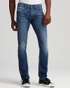 Wiskering and fading lend rugged appeal to these straight leg jeans from Hudson.