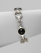 An unique and modern design featuring black agate spherical inset links and sterling silver circular links. Black agateSterling silverToggle closureLength, about 7½Imported 