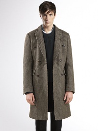 Basket weave, double-breasted overcoat with velvet detail under the collar.Front patch pocketsSingle back ventAbout 39.4 long84% wool/16% silkDry cleanMade in Italy