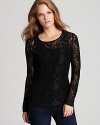 Brimming with dark romance, a sheer-lace Isaac Mizrahi Jeans top lends a touch of drama to your daytime repertoire.