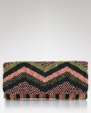 A retro-chic zig zag pattern shines on this clutch by MOYNA, covered in metallic beads. It instantly elevates any ensemble.