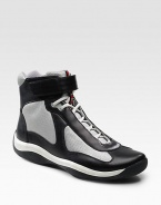 Leather and mesh with hook-and-tab ankle closure. Padded insole Rubber sole Imported 