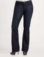 This flattering high-waist bootcut fit features soft distressing for a modern look.THE FITFitted through hips and thighs High-rise Inseam, about 34THE DETAILSZip fly with button closure Five-pocket style 70% cotton/27% polyester/3% Lycra spandex Machine wash Made in the USA of imported fabric