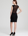 A lace back in black is devastatingly chic on this French Connection dress. Pair with peep toe pumps, and this piece is party-ready.