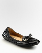 Stretchy patent leather with a dainty bow embellishment. Patent leather upperLeather lining and solePadded insoleMade in Italy