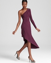 Stop tracks in ABS by Allen Schwartz's one shoulder dress, made modern with a skin-bearing one shoulder silhouette and an asymmetric hem.