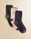 Three-pack of ribbed dress socks with contrast color tipping at cuff, pony, heel and toe. Each 3-pack includes black with green, white with blue, navy with red.Dress-style to wear with slacks70% cotton/26% polyester/4% spandexMachine washImportedAdditional InformationKid's Shoe Size Guide (European Equivalent) 