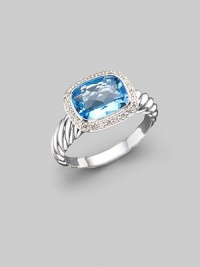 From the Noblesse collection. A glimmering blue topaz, surrounded by diamonds, balances elegantly on a cable band of sterling silver. Diamonds, 0.21 tcw Blue topaz Sterling silver Imported