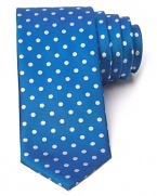 Playful polka dots adorn a classic silk tie from BOSS Black.