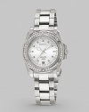 This sturdy yet feminine timepiece features a bezel of sparkling Swarovski crystals.Swiss quartz movement Water resistant to 10 ATM Swarovski crystal bezel Round stainless steel case, 34mm, (1.33) Date display at 6 o'clock Second hand Stainless steel link bracelet Safety lock closure Imported