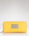 MARC BY MARC JACOBS' zip around leather wallet is a practical accessory with a playful side. In a punched up hue, this wallet is almost too chic to hide in your purse.