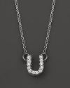 From the Tiny Treasures collection, a diamond U necklace. With signature ruby accent. Designed by Roberto Coin.