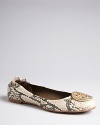 Tory Burch snakes her beloved Reva ballet flats to another level in reptile-embossed leather, finished with her signature goldtone logo accents.