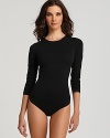 A body hugging long sleeve bodysuit that is a beautiful mix and match item for any wardrobe. Style #075022