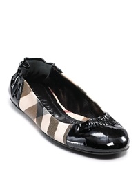 Burberry's take on the ballet flat makes for a chic shoe with check and patent leather details.