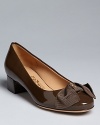 Distinctively shaped grosgrain bows define these Salvatore Ferragamo pumps.