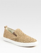 Sport around town in style in this delicately woven slip-on of rich, supple suede and contrasting rubber sole.< Leather liningPadded insoleRubber soleImported