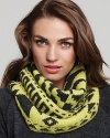 Add eclectic flair to any coat or sweater with Echo's oversized, tribal-print neckwarmer.