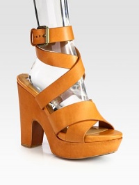 Soft leather style with a chunky block heel and adjustable criss-cross straps. Self-covered heel, 4½ (140mm)Covered platform, 1½ (40mm)Compares to a 3 heel (75mm)Leather upperLeather lining and solePadded insoleMade in ItalyOUR FIT MODEL RECOMMENDS ordering one half size up as this style runs small. 