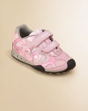 Designed for your little girl on-the-go, these eye-catching, sparkly sneaks light-up while she walks, plus feature patented, breathable technology that absorbs and expels sweat, while keeping out water.Double grip-tape closureTextile upperTextile liningRubber solePadded insoleImported