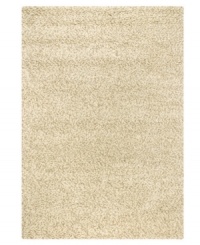 Throw it in neutral. This natural-toned area rug by Couristan is created by blending different thicknesses of soft wool yarn, blissfully plush with an ultra-thick pile that's rich in both texture and tone.