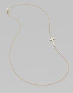 A wispy chain of 14k yellow gold features a cross pendant set askew for a modern edge.14k yellow gold Length, about 16 Pendant length, about ¾ Spring ring clasp Made in USA