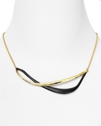 Alexis Bittar's intertwined gold necklace is a striking example of the label's contemporary edge. With modernism the mood, slip it on to transform a favorite tee shirt from basic to bold.