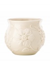 Already teeming with fresh blooms, the Floral Fields cachepot from Lenox has a serene, understated elegance in graceful ivory porcelain. A charming centerpiece!