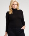 Fine-gauge Merino wool in a classic silhouette.Ribbed collarLong sleevesPullover styleAbout 25½ from shoulder to hemMerino woolDry cleanImported