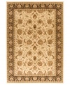 Taking its namesake from the original Kashan rugs of Persia, this area rug displays a regal look with intricate medallions in a light gold, cream, black colorway with hints of crimson. Made in the USA of lush, heat-set polypropylene for sheer durability and effortless style. (Clearance)