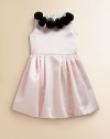 She'll be picture perfect in this frilly, satin frock embellished with delicate rosettes for a sweet ensemble.Jewelneck with rosette detailSleevelessBack zipperFull skirtPolyesterDry cleanMade in the USA