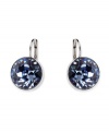 Sharpen your look with a subtle hint of color. Earrings by Swarovski feature round-cut lapis crystals set in silver tone mixed metal. Approximate drop: 1 inch.