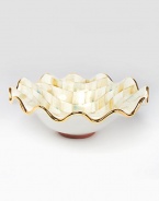 This remarkably unique bowl, in hand-painted terra cotta with color-dragged checks and golden trim, creates an ultra-glamorous presentation piece for you and your guests.Ceramic with golden lustre14.5 diam.Hand washMade in the USA