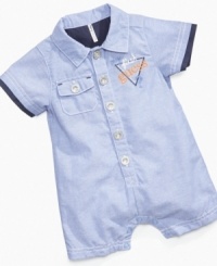 Keep him styling in the sun with this handsome chambray romper from Guess.