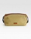 An impeccably stylish carrying case for the modern gentleman, this lightweight pouch in a leather-trimmed canvas construction provides sharp transport for essential toiletries.Zip closureInterior zip pocketAntiqued brass hardwareEmbossed leather logo accents the exteriorCanvas9W x 5HImported