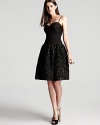 A petal and sequin embellished skirt lends a youthful, girlish feel to a sweetheart silhouette from ML Monique Lhuillier.